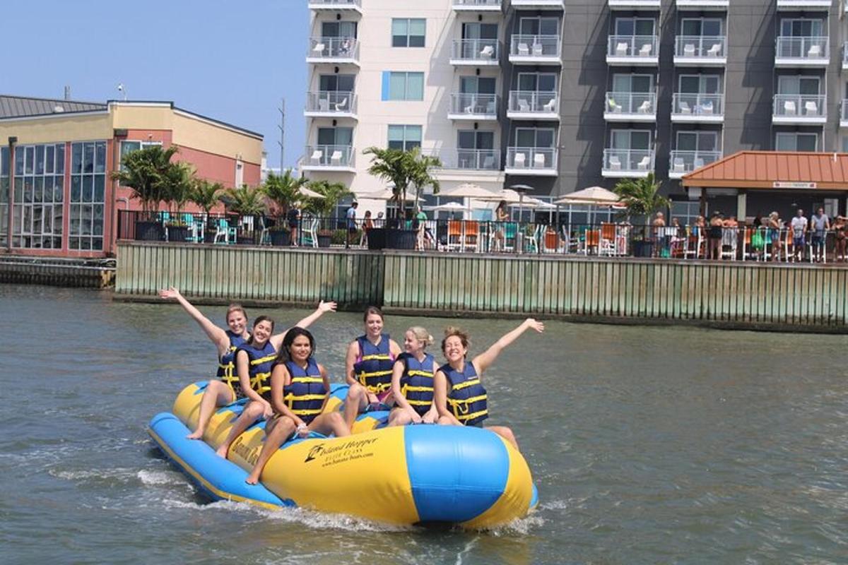 a group of people riding on a raft in the water