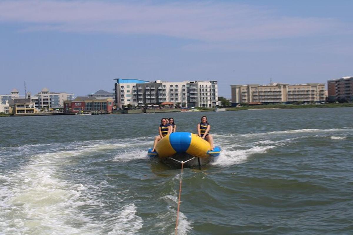 two people riding on a raft in the water