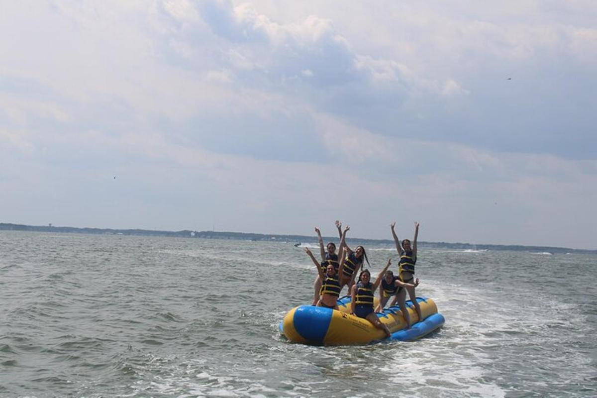 a group of people on a raft in the water