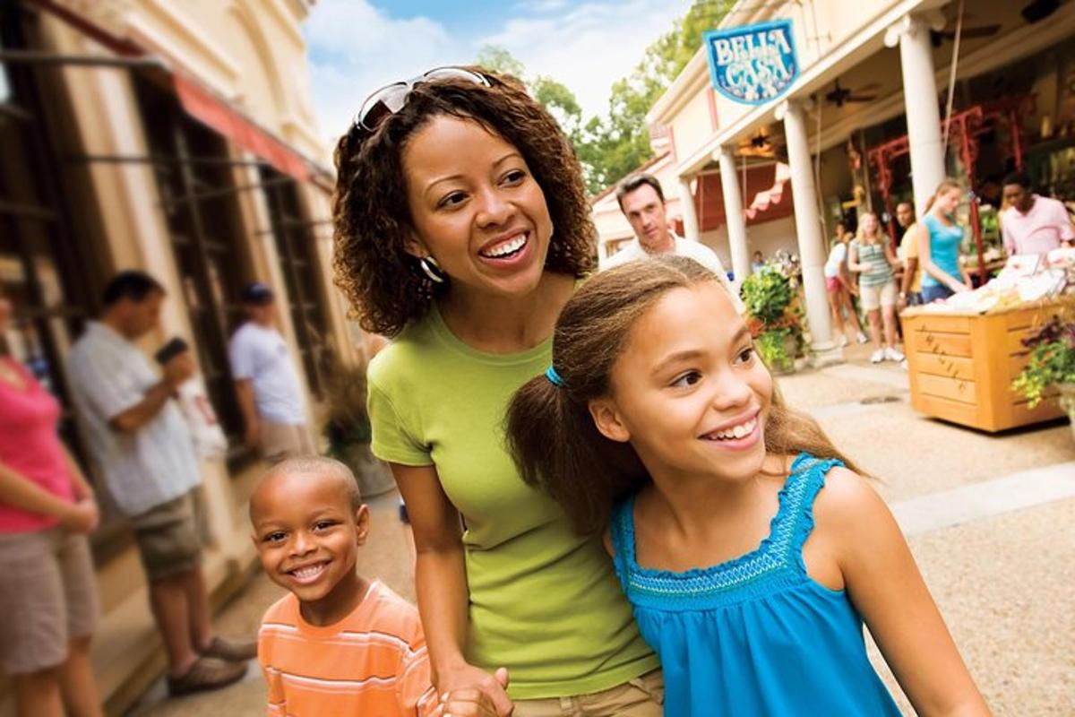 two girls and a child standing on a street
