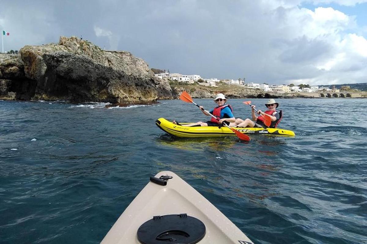 two people are sitting in kayaks in the water