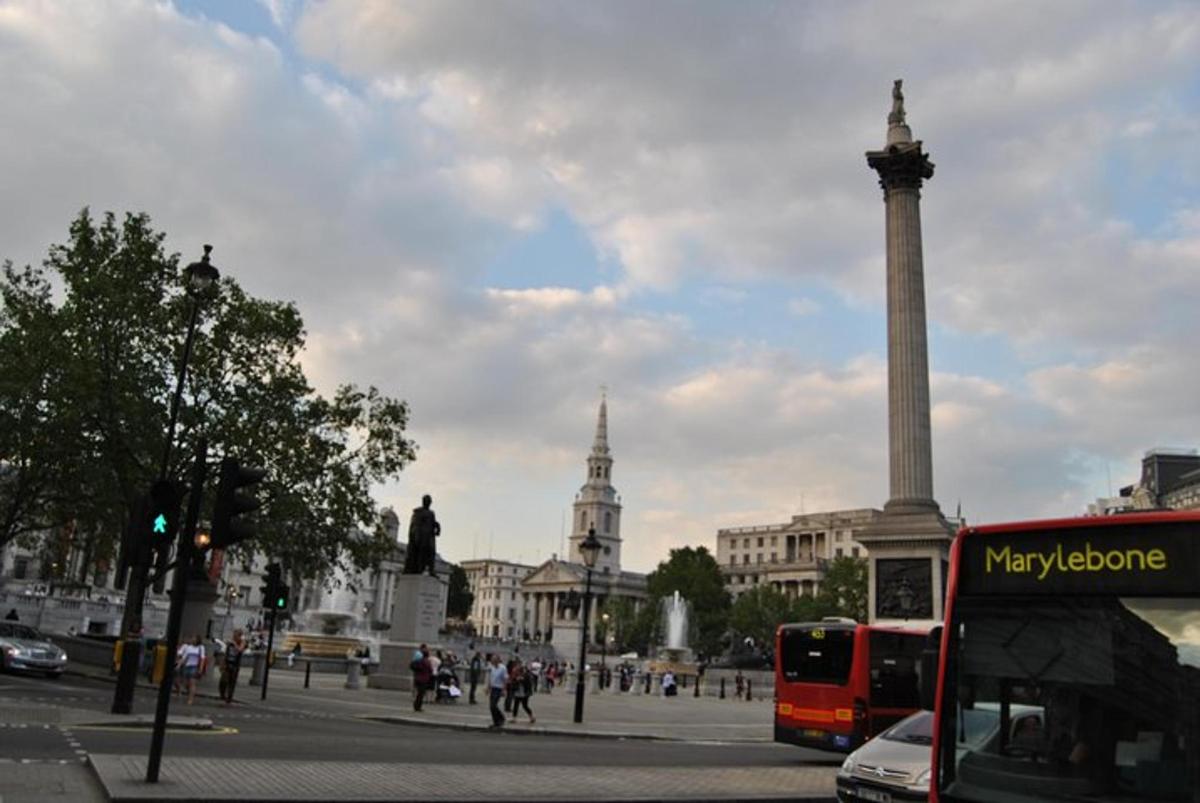 a city with a tall monument in the middle of a street