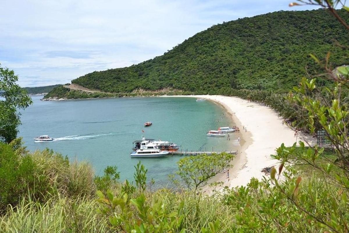 a boat is docked on a beach next to a beach