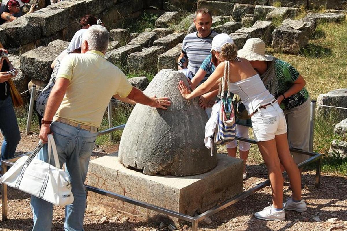 a group of people standing around a statue