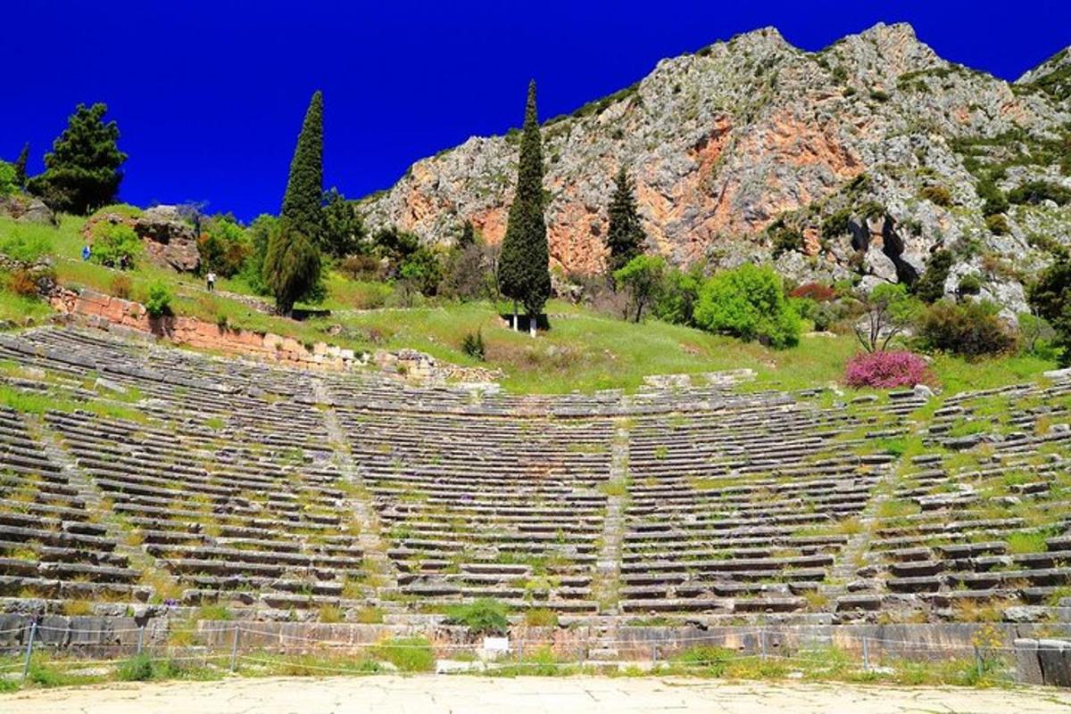 an empty amphitheater with a mountain in the background