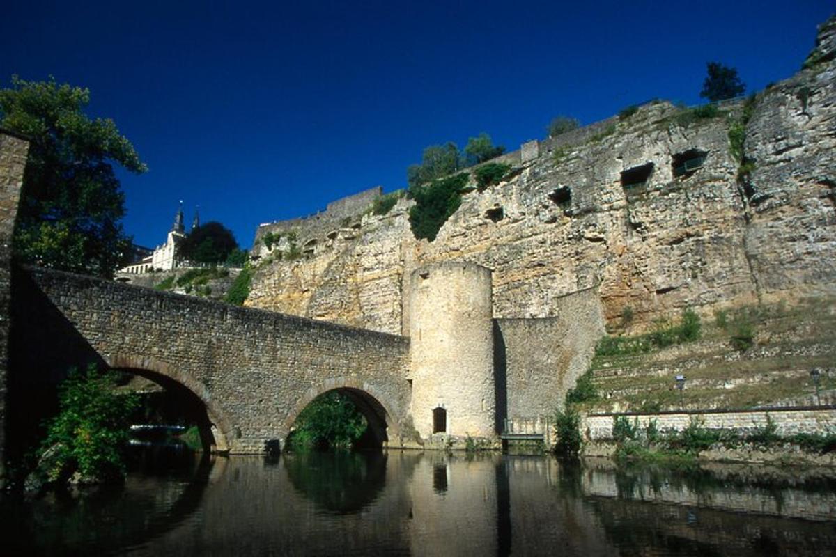 an old stone bridge over a body of water