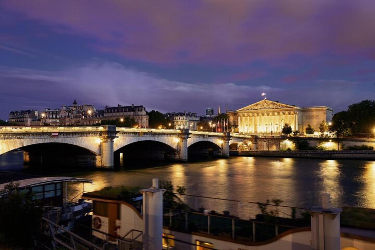 a bridge over a river in a city at night