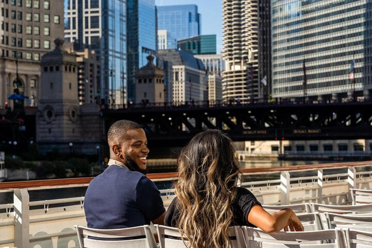 a man and a woman sitting in chairs looking at the city