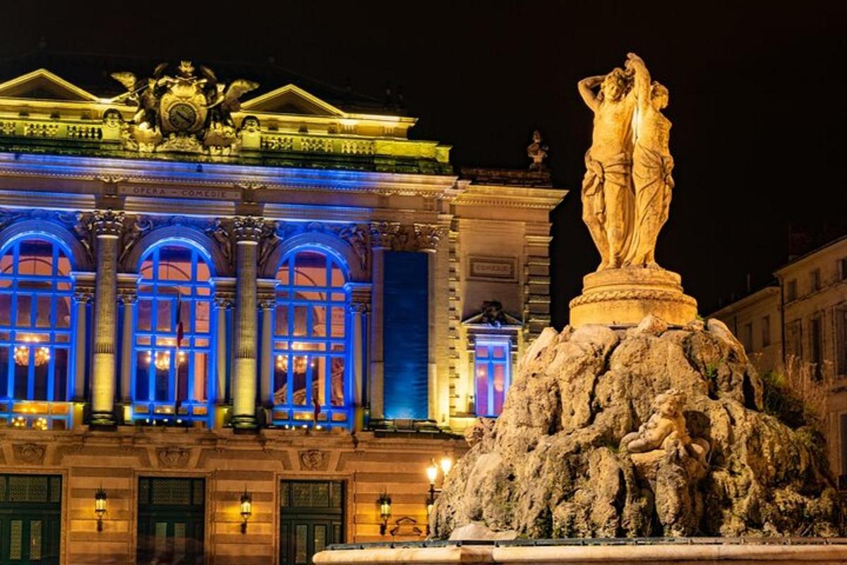 a statue in front of a building with blue lights