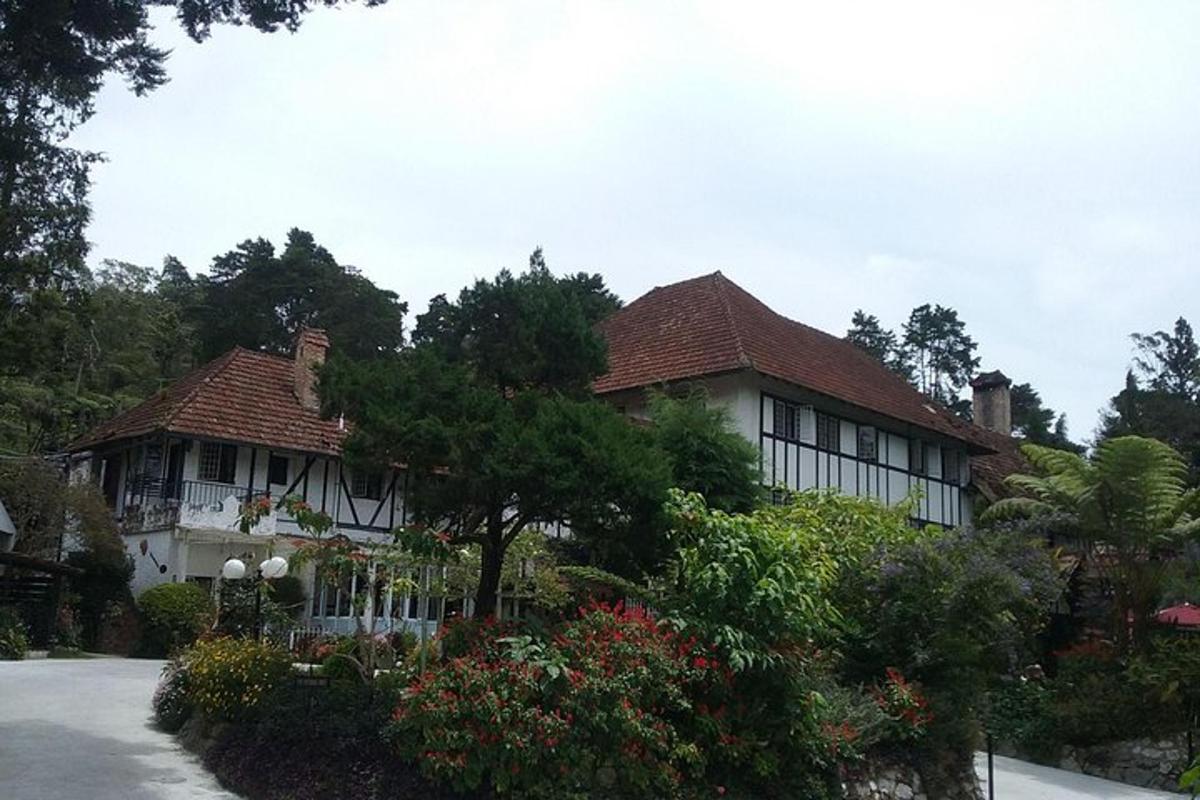 a large white house with a red roof