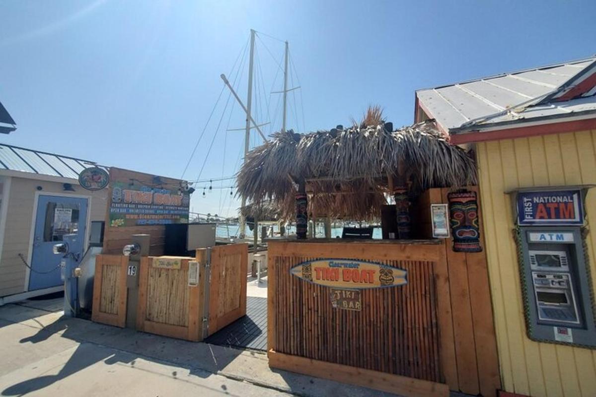 a building with a bar with a straw roof