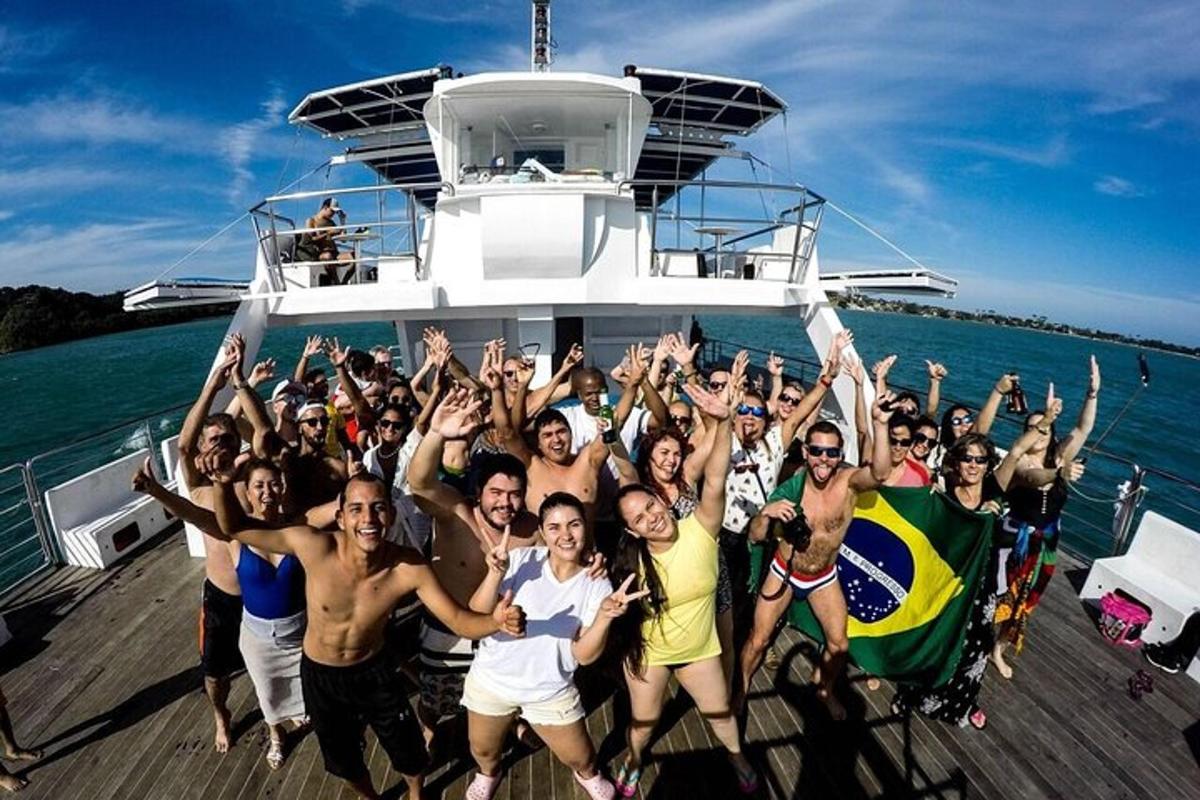 a group of people posing for a picture on a boat