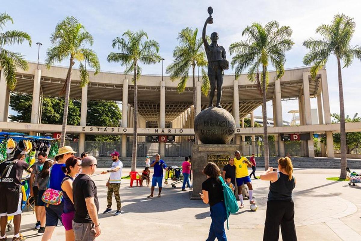 a group of people standing around a statue in front of a building