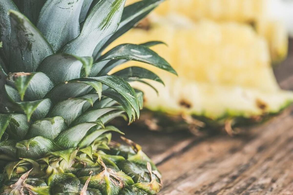 a close up of a pineapple on a wooden table