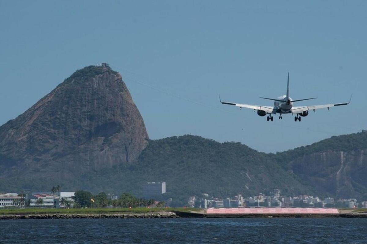 an airplane is flying over a body of water
