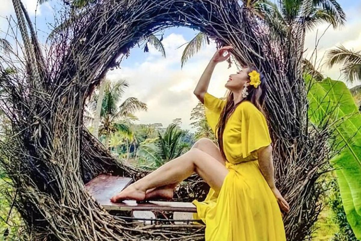 a woman in a yellow dress is sitting in a nest