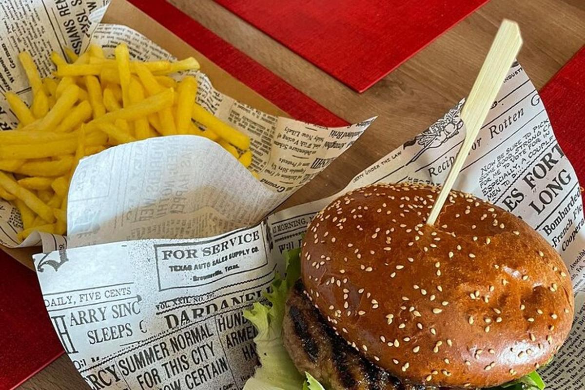 a hamburger and french fries on a table