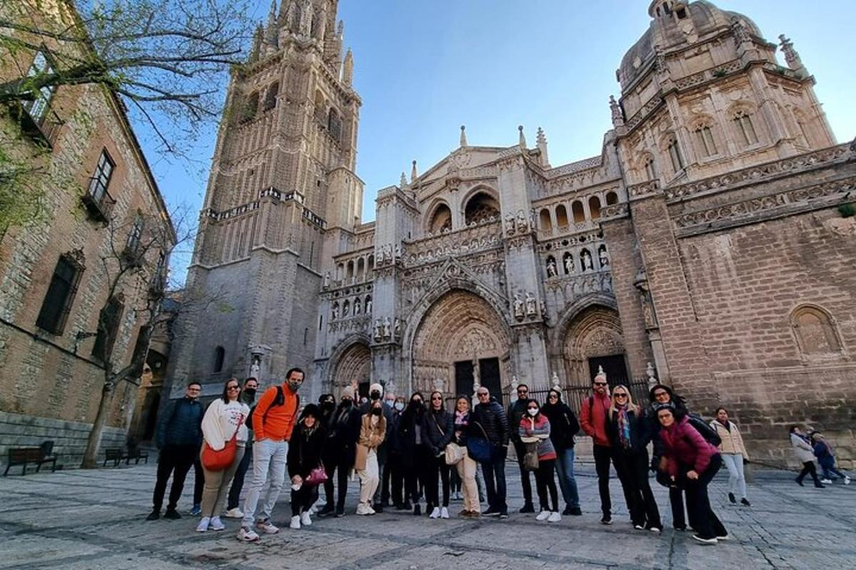a group of people standing in front of a cathedral