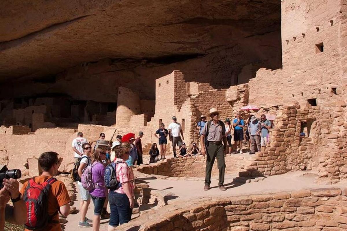 a group of people walking on the ruins