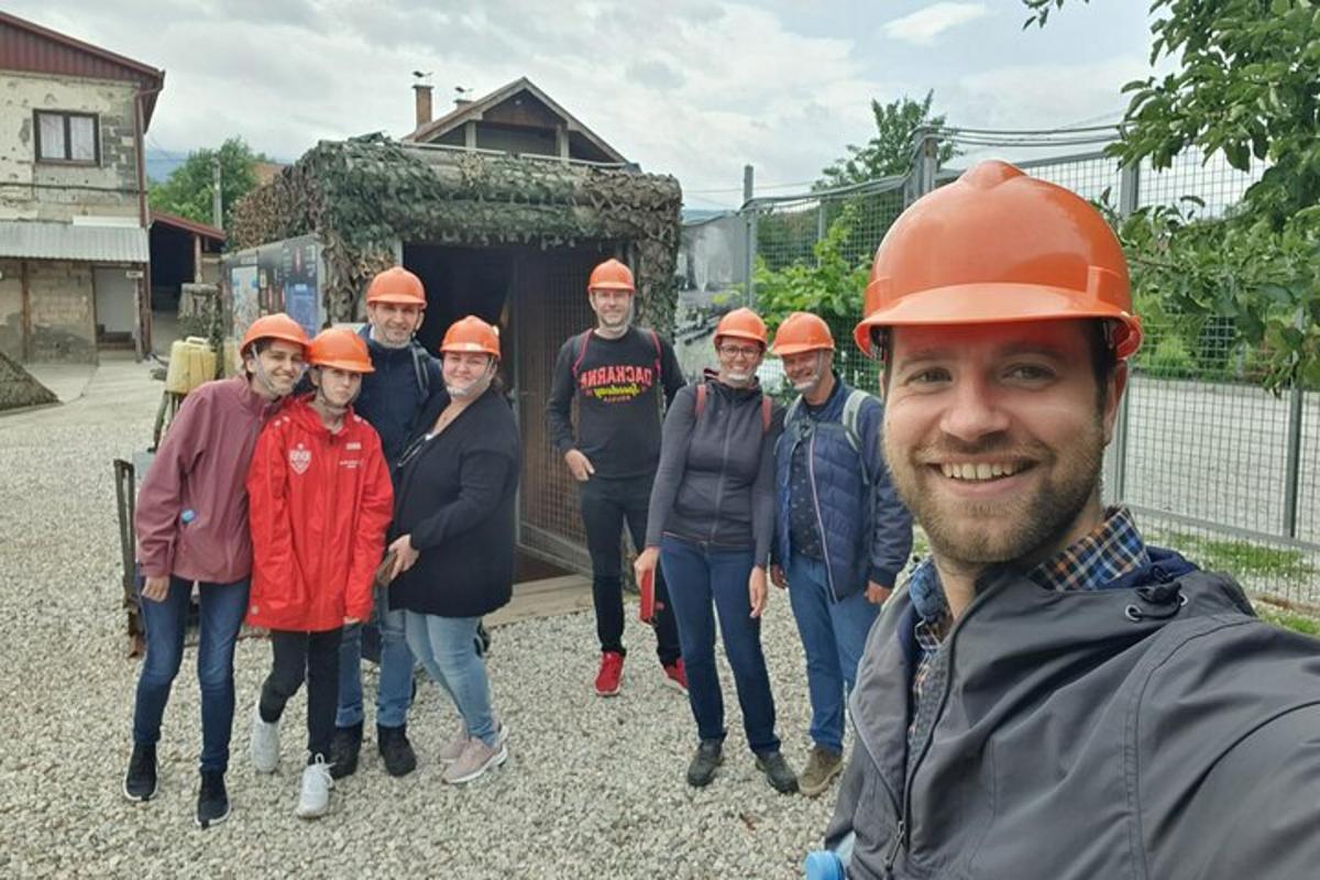 a group of people wearing hard hats posing for a picture