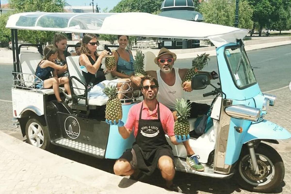 isang grupo ng mga tao na nakaupo sa isang golf cart