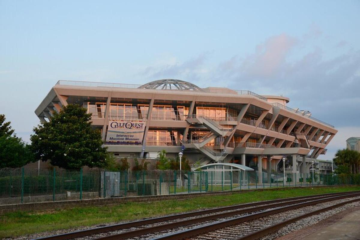 a building with a train tracks in front of it
