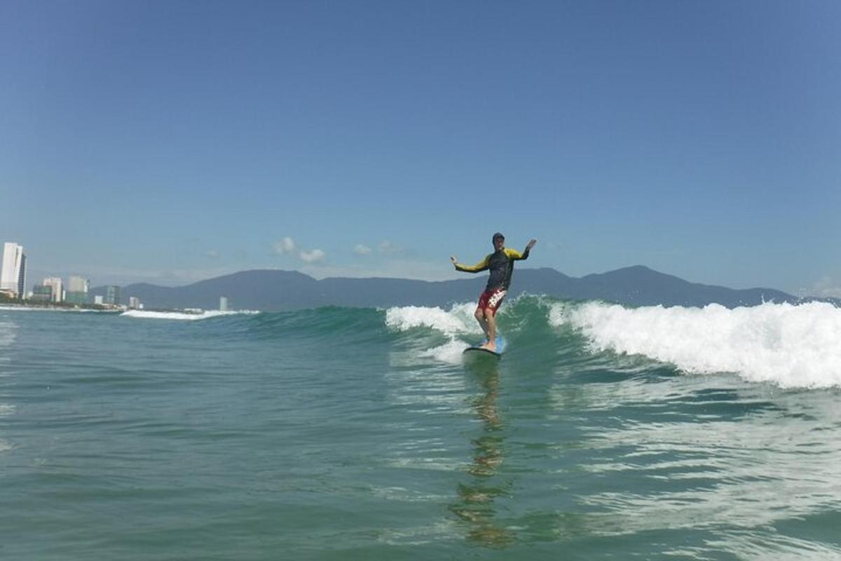a man riding a wave on a surfboard in the ocean