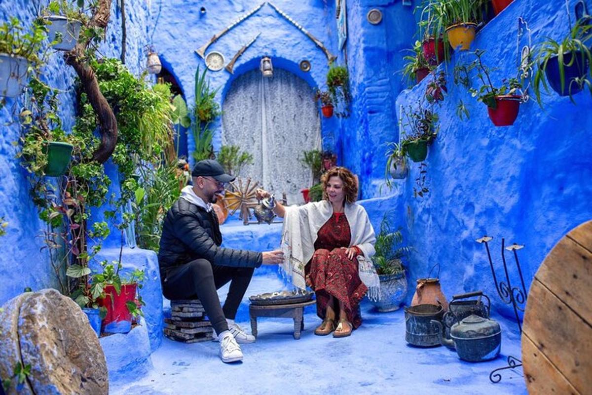 a man and a woman sitting in a blue room