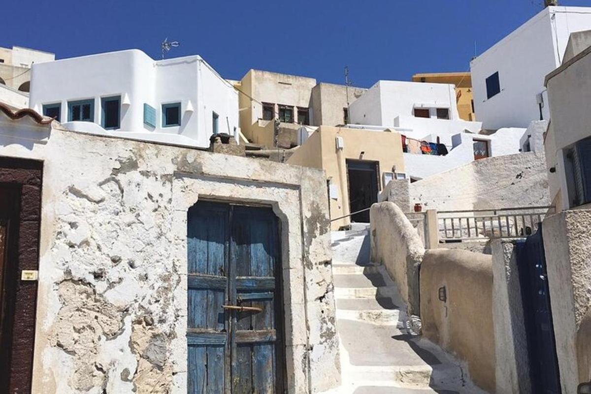 a building with a blue door in a village