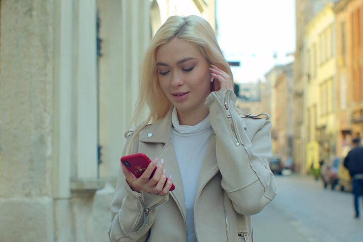 a woman is talking on a cell phone