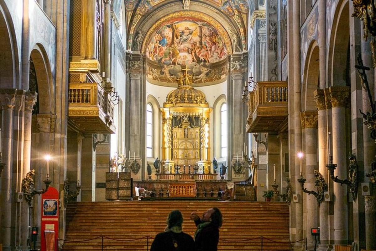 two people taking a picture of a church