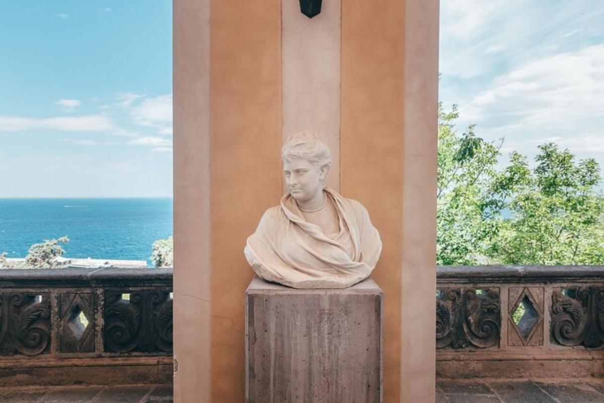 a statue of a bust of a woman sitting on a column