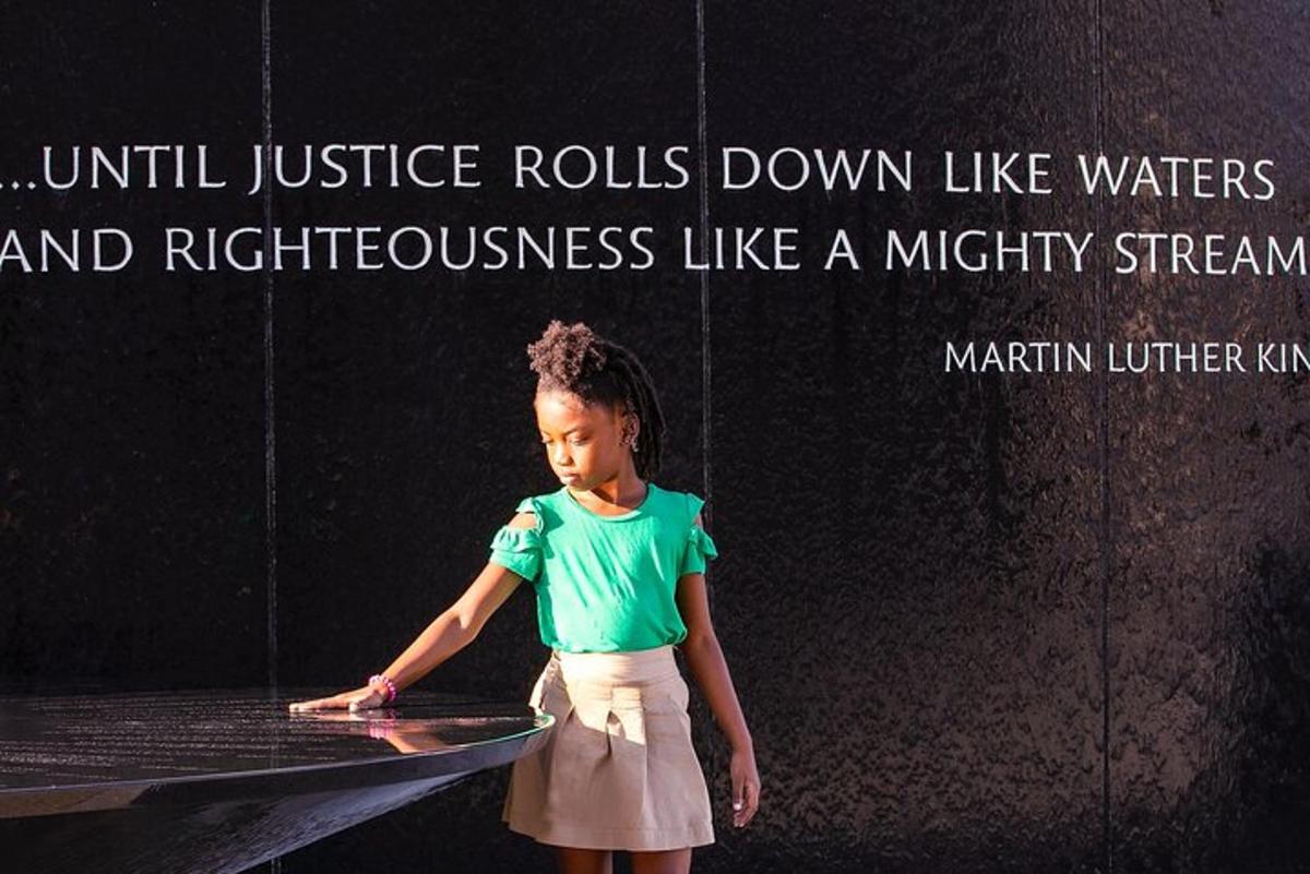 a little girl standing on a table with a quote