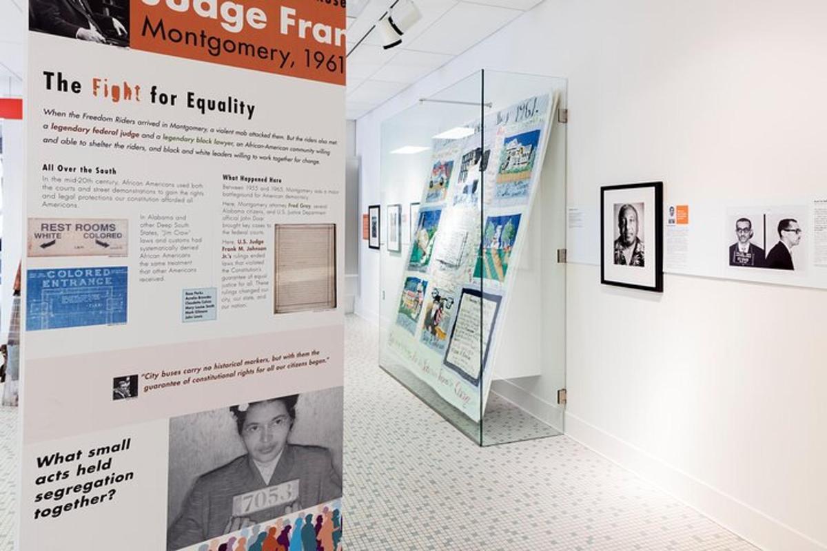 a exhibit in a museum with posters on the wall