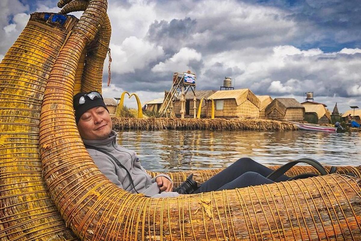 a man sitting in a boat on the water