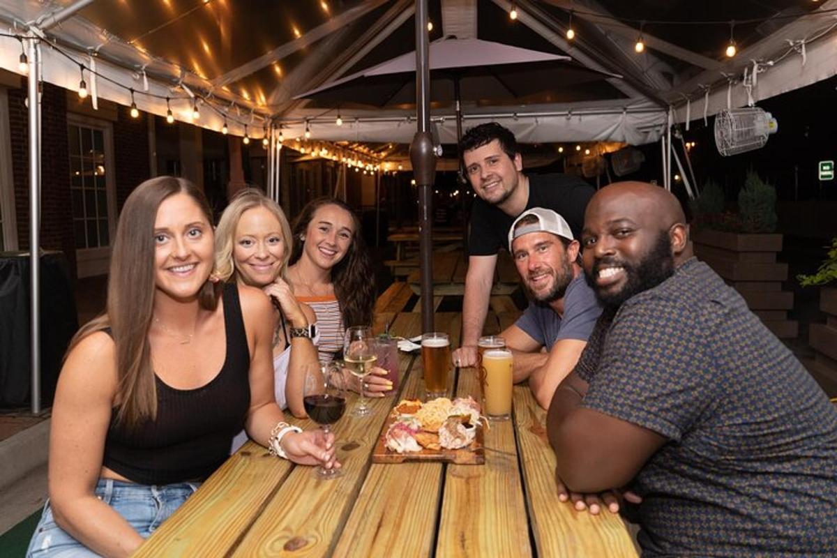 a group of people sitting around a wooden table