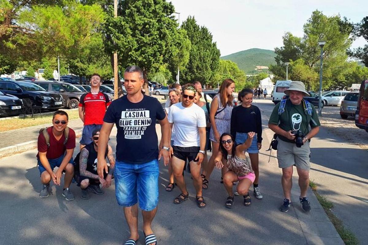 a group of people standing in a parking lot