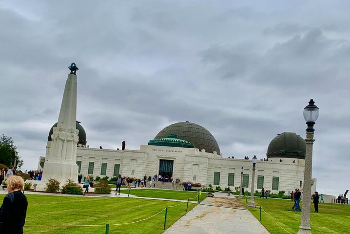 a large building with a monument in front of it