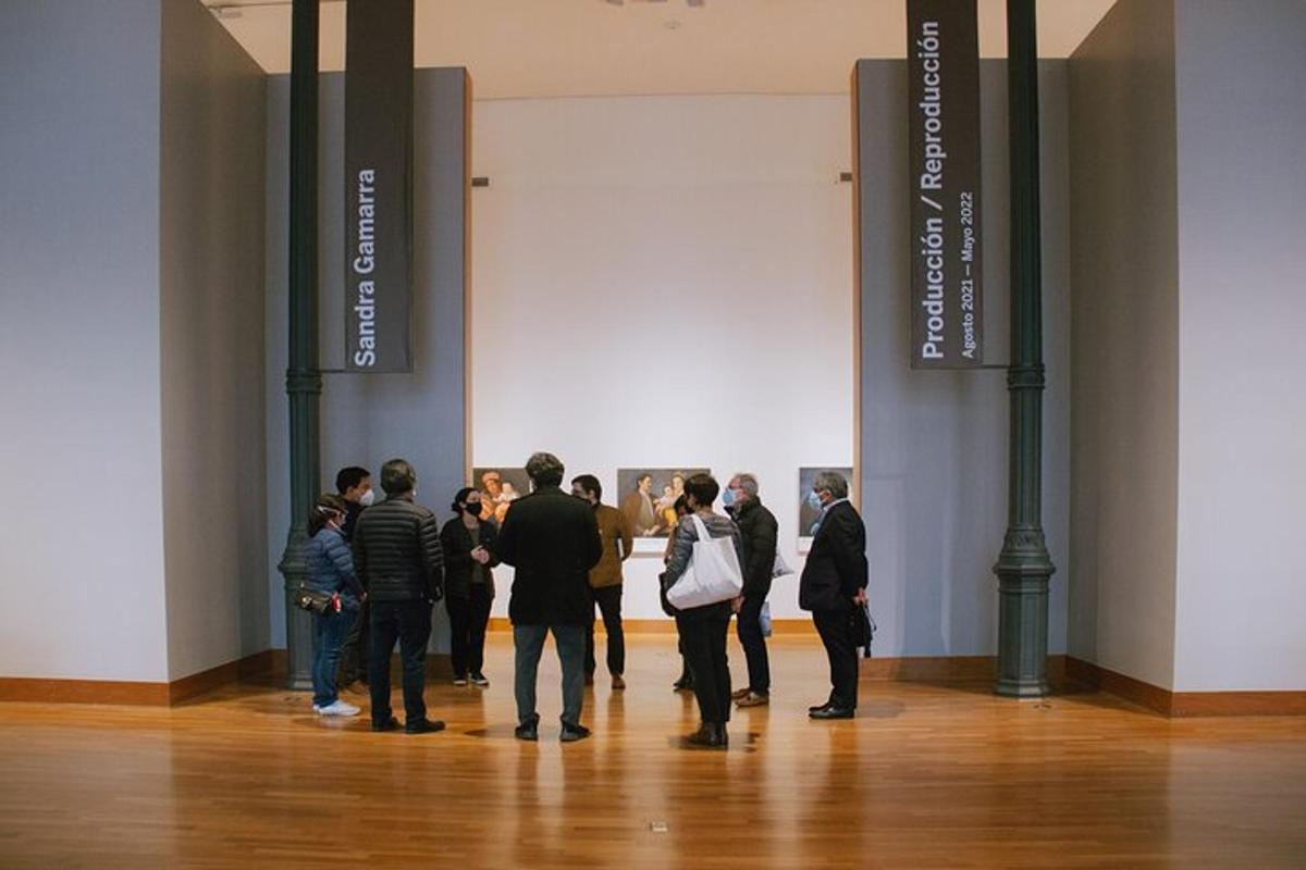 a group of people standing in an art exhibit