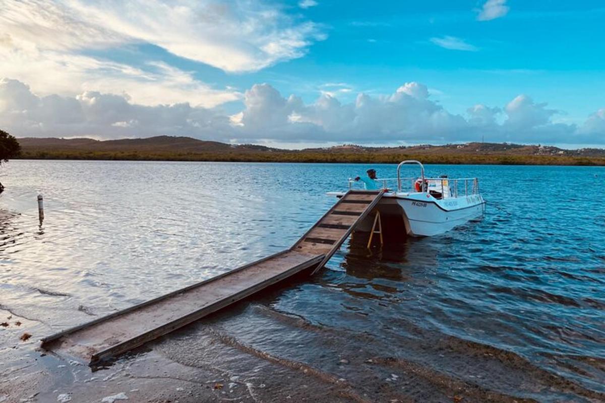 a boat is docked at a dock on a lake