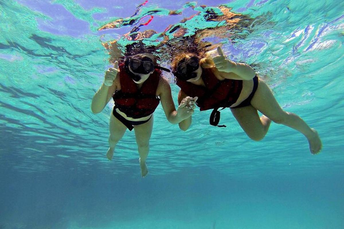 two people are swimming in the water