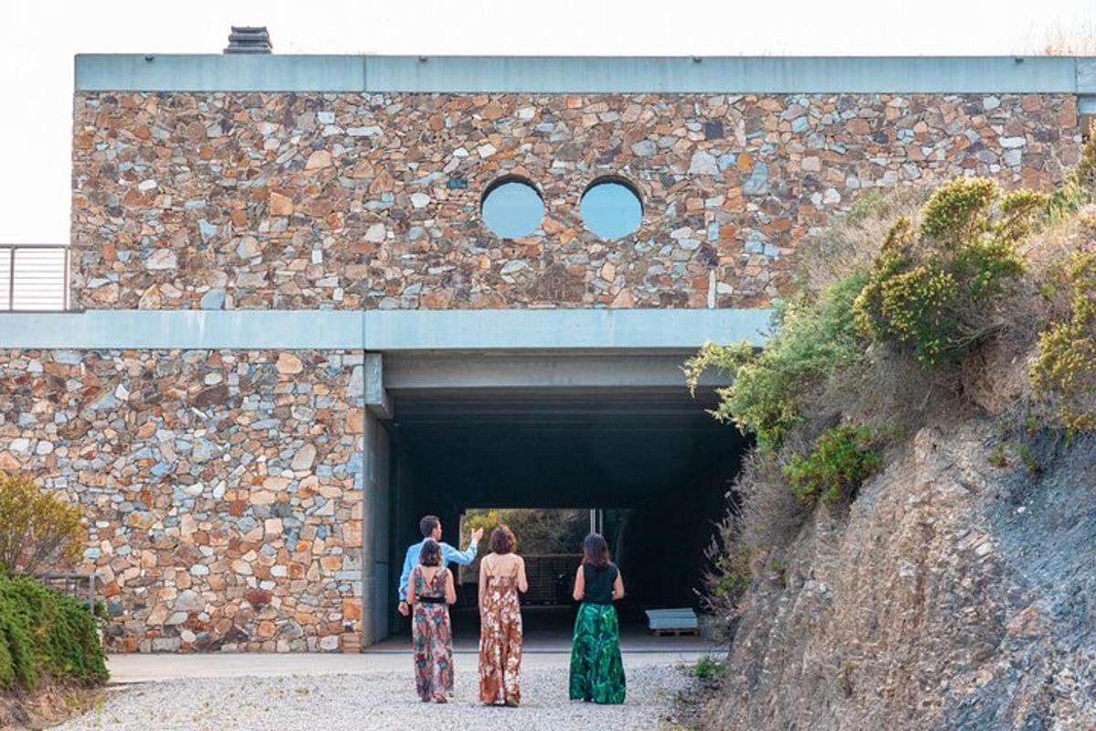 a group of three women standing in a tunnel