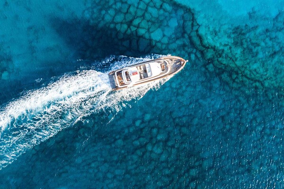 a boat in the water with a wave