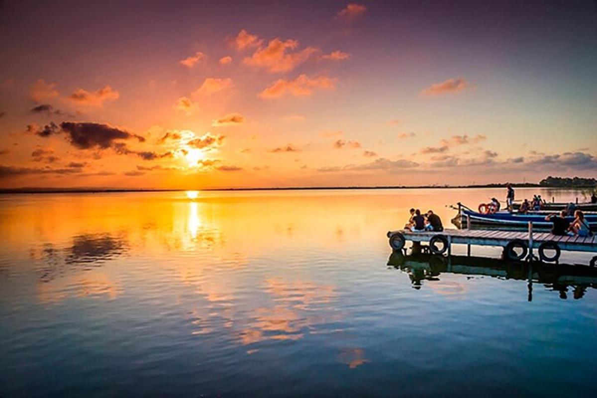 a group of people on a boat on a body of water