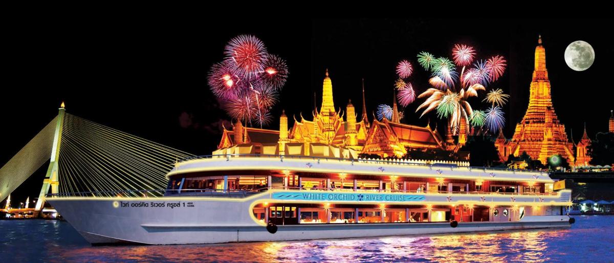 a cruise ship in the water with fireworks
