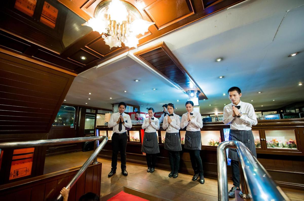 a group of men standing in front of a bar