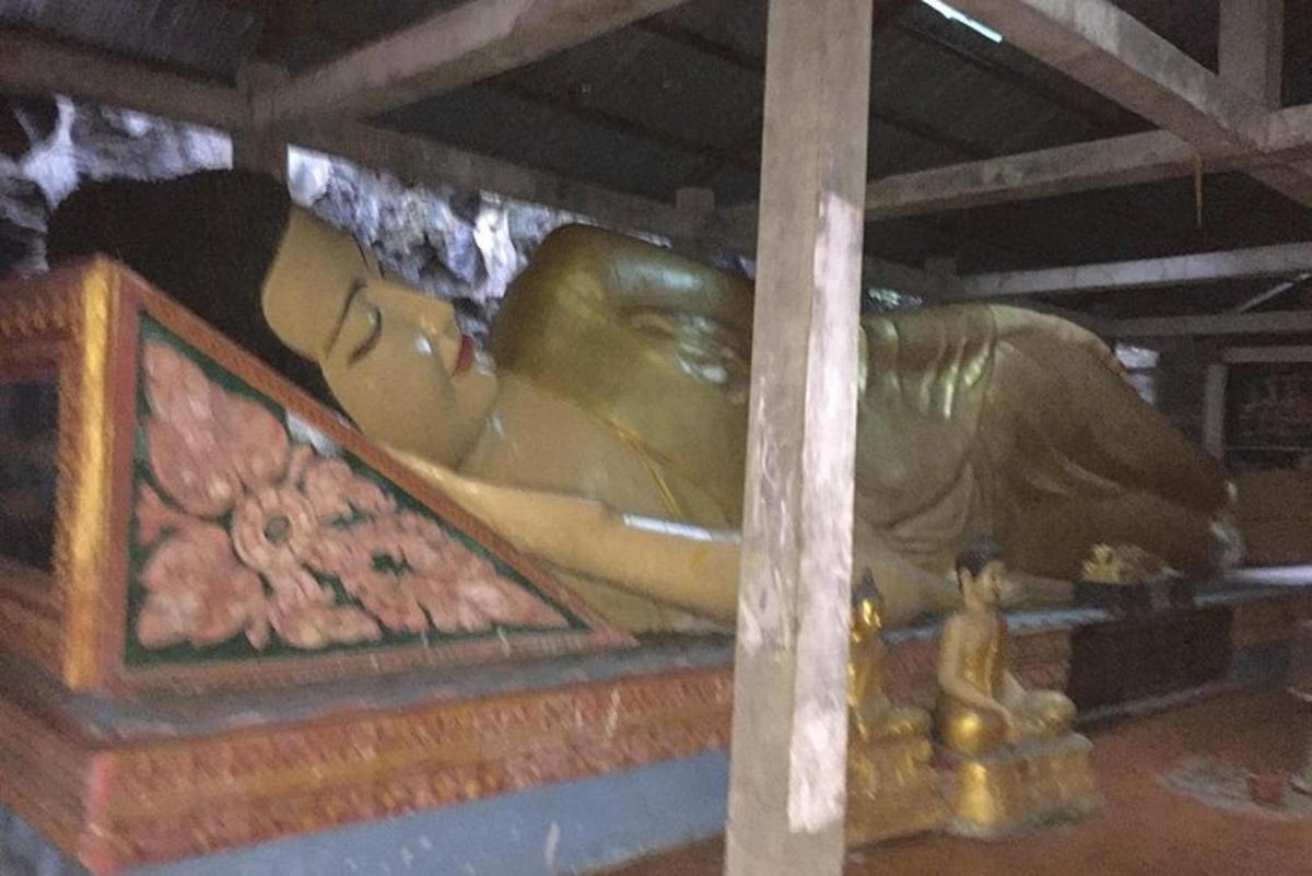 a statue of a woman laying on a bed