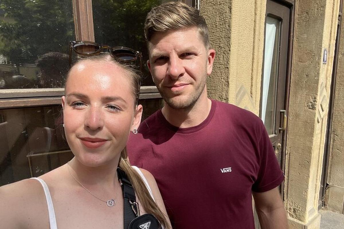 a man and a woman standing next to each other