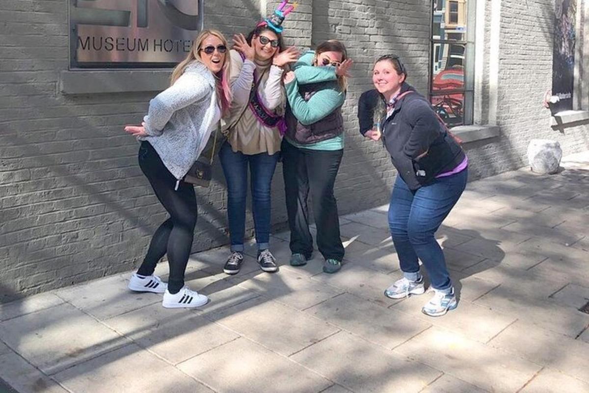 a group of women standing next to a building