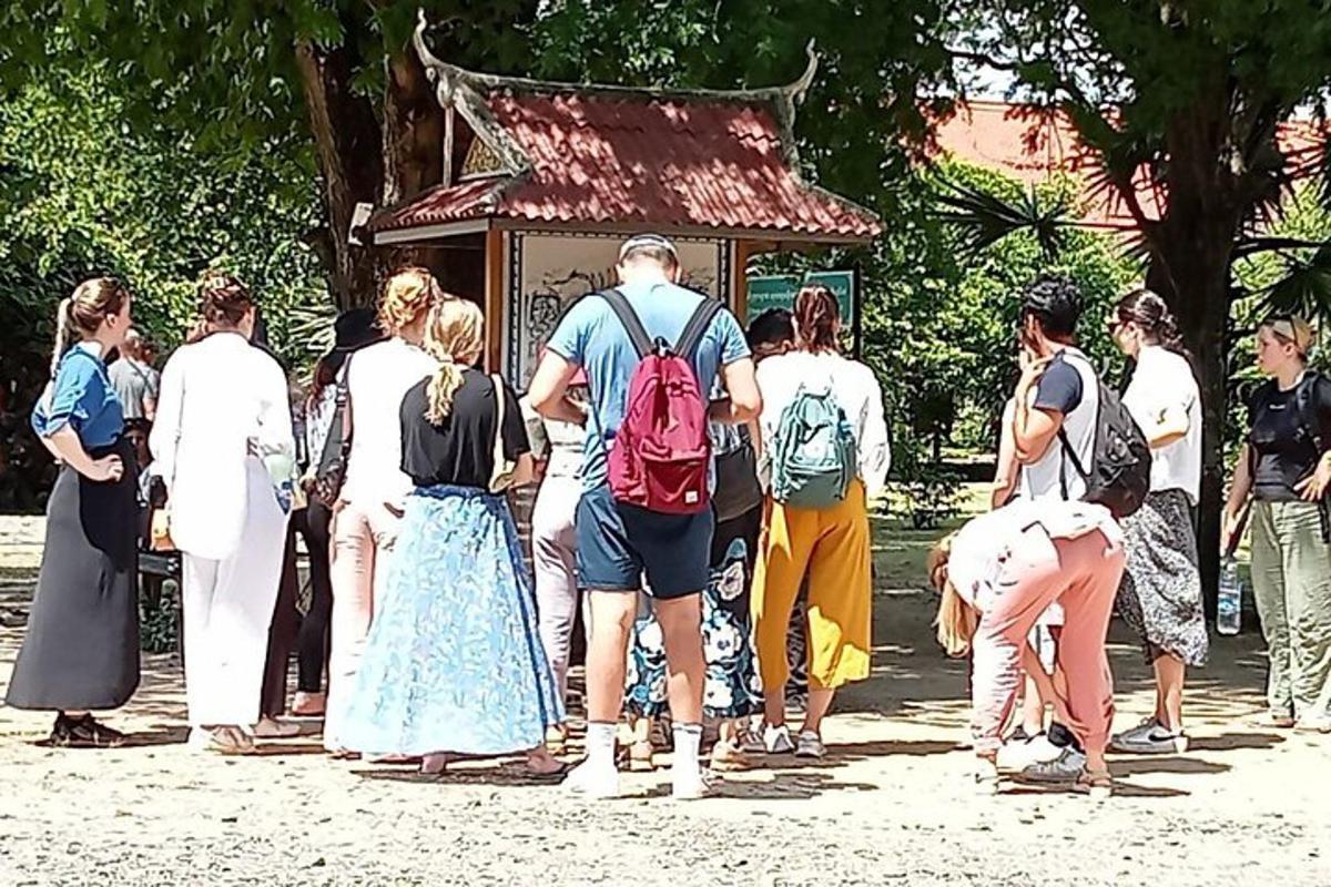 a group of people standing in front of a temple
